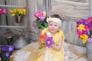 Scarlett holding tulips – showing that payment reminders can be just as gentle and beautiful